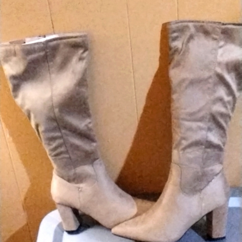 A pair of beige faux seude boots